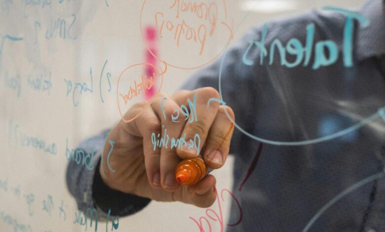 person holding orange flower petals